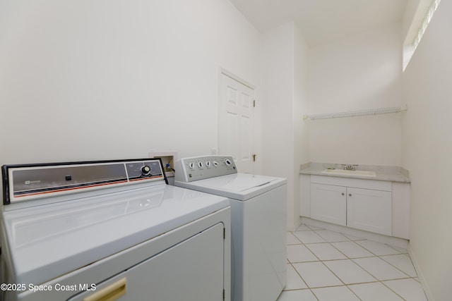 7433 Monterey Ct, Melbourne, FL 32940 - clothes washing area featuring a sink, independent washer and dryer, light tile patterned flooring, and baseboards