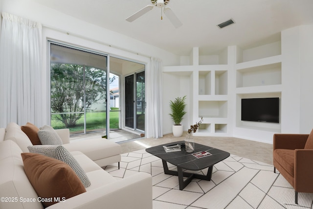 7433 Monterey Ct, Melbourne, FL 32940 - living area featuring built in shelves and ceiling fan