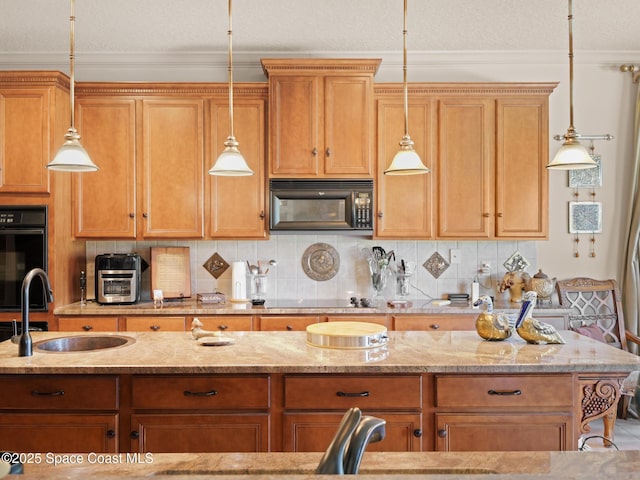 1013 Balmoral Way, Melbourne, FL 32940 - kitchen with black appliances, a sink, light stone countertops, hanging light fixtures, and ornamental molding