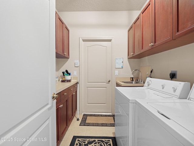 1013 Balmoral Way, Melbourne, FL 32940 - laundry area with washing machine and dryer, cabinet space, and light tile patterned floors