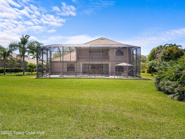 1013 Balmoral Way, Melbourne, FL 32940 - back of house with a yard, glass enclosure, and a patio