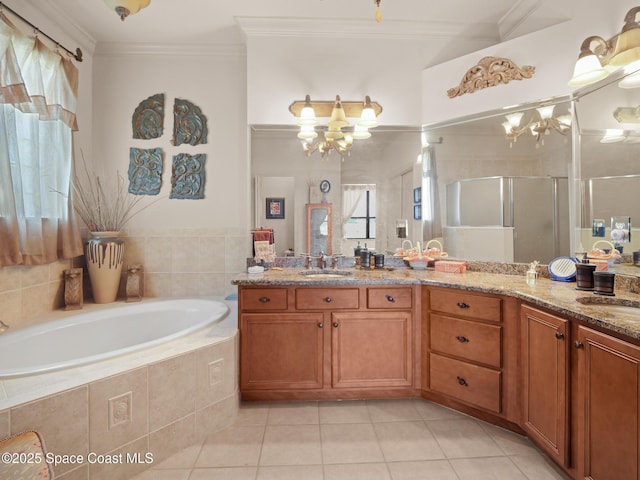 1013 Balmoral Way, Melbourne, FL 32940 - full bath featuring tile patterned flooring, a chandelier, a garden tub, a shower stall, and crown molding