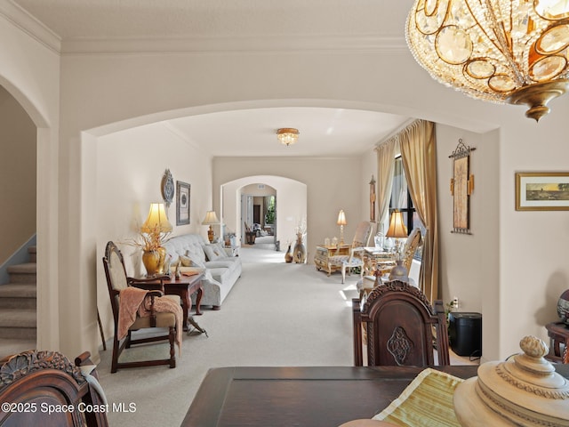 1013 Balmoral Way, Melbourne, FL 32940 - carpeted dining room with arched walkways, stairway, ornamental molding, and a chandelier