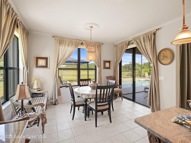 1013 Balmoral Way, Melbourne, FL 32940 - dining area featuring ornamental molding, healthy amount of natural light, and light tile patterned floors