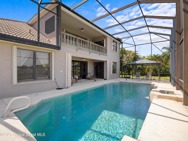 1013 Balmoral Way, Melbourne, FL 32940 - swimming pool featuring a patio and glass enclosure