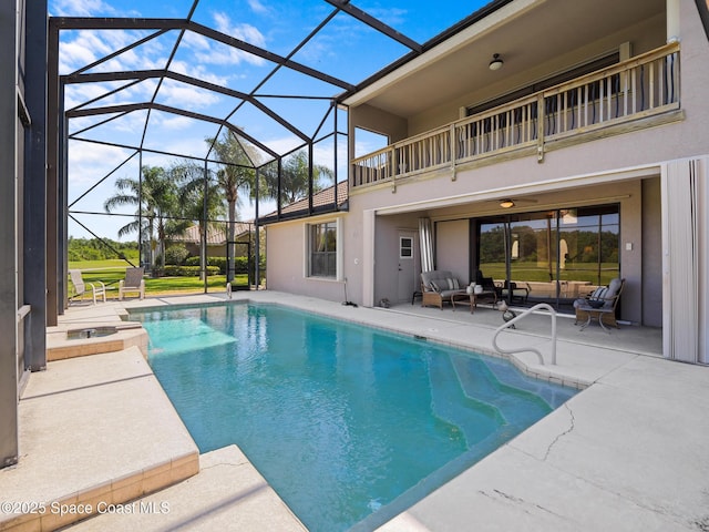 1013 Balmoral Way, Melbourne, FL 32940 - view of pool featuring outdoor lounge area, a patio, a lanai, and a pool with connected hot tub