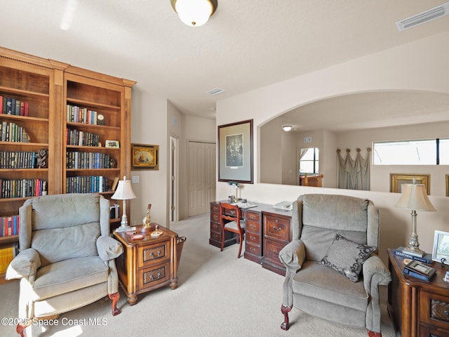 1013 Balmoral Way, Melbourne, FL 32940 - living area with arched walkways and carpet