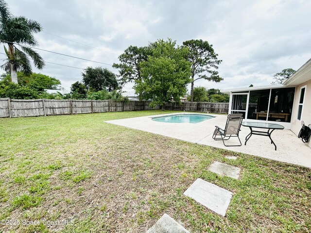 164 Bayamo Ave NE, Palm Bay, FL 32907 - view of yard with a sunroom and a patio area