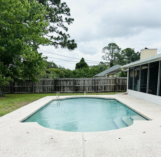 164 Bayamo Ave NE, Palm Bay, FL 32907 - view of pool featuring a sunroom, a fenced backyard, and a patio