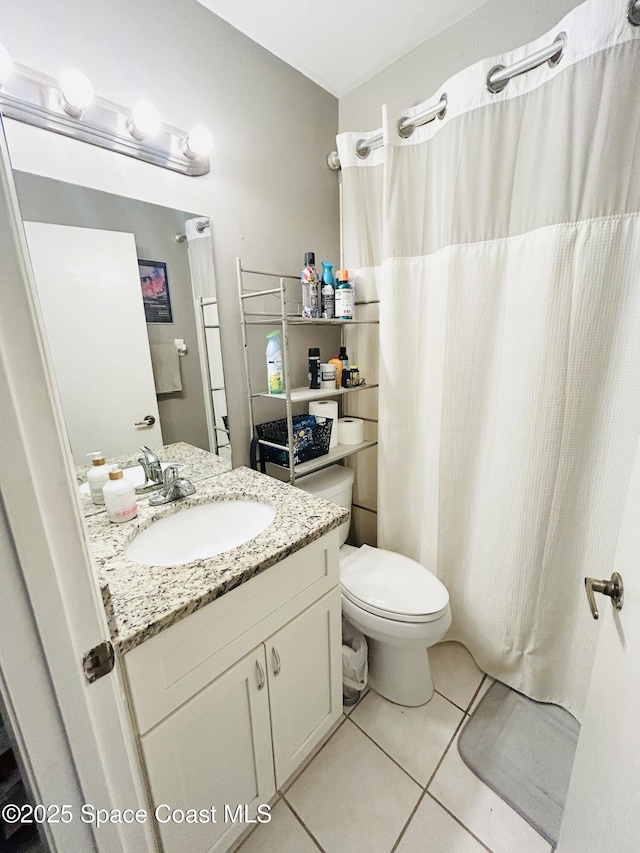 164 Bayamo Ave NE, Palm Bay, FL 32907 - bathroom featuring tile patterned flooring, toilet, and vanity