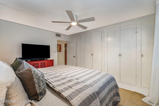 847 W Virginia St, Cocoa, FL 32927 - carpeted bedroom with two closets and ceiling fan