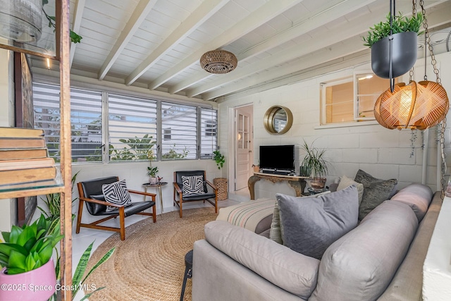 847 W Virginia St, Cocoa, FL 32927 - living room featuring beam ceiling, stairway, and concrete block wall