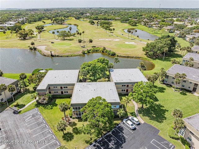 drone / aerial view of a large body of water and a golf course