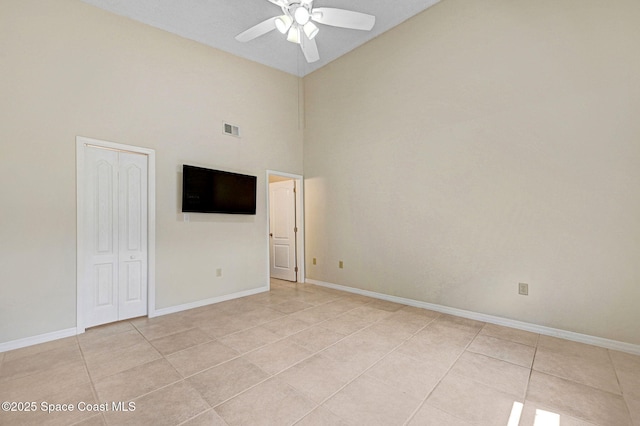 1600 Woodland Dr Unit 4206, Rockledge, FL 32955 - unfurnished room featuring light tile patterned floors, ceiling fan, baseboards, and high vaulted ceiling