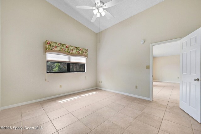 1600 Woodland Dr Unit 4206, Rockledge, FL 32955 - spare room with light tile patterned flooring, ceiling fan, lofted ceiling, and baseboards