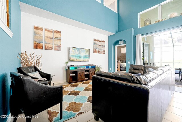 2648 Daulby St, Kissimmee, FL 34747 - living room with tile patterned flooring and a high ceiling