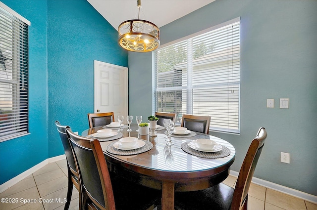 2648 Daulby St, Kissimmee, FL 34747 - dining room featuring light tile patterned floors, a chandelier, baseboards, and a textured wall