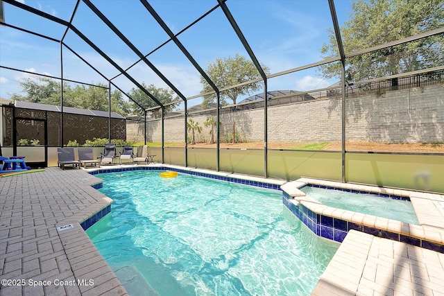 2648 Daulby St, Kissimmee, FL 34747 - view of pool with a pool with connected hot tub, a patio area, and glass enclosure