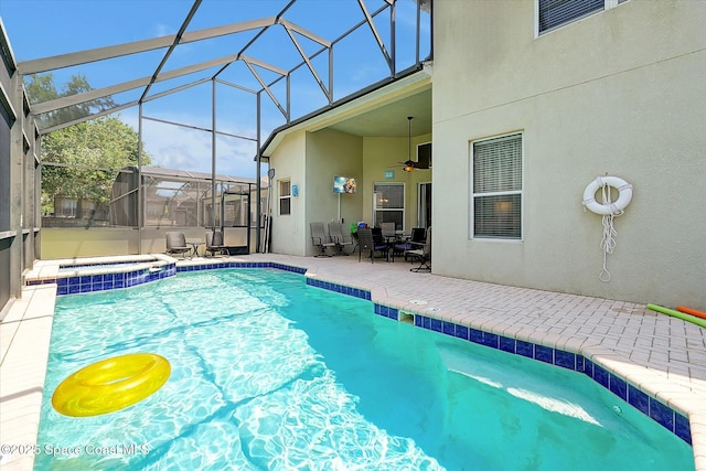 2648 Daulby St, Kissimmee, FL 34747 - view of swimming pool featuring a patio area, ceiling fan, a pool with connected hot tub, and a lanai