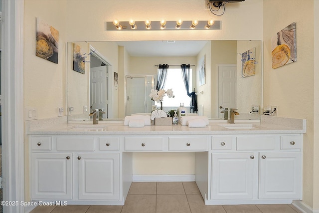 2648 Daulby St, Kissimmee, FL 34747 - bathroom with a shower stall, tile patterned floors, and double vanity