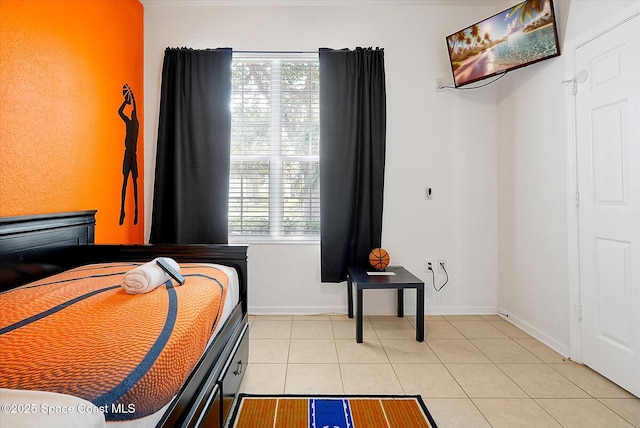 2648 Daulby St, Kissimmee, FL 34747 - bedroom with light tile patterned floors, multiple windows, and baseboards
