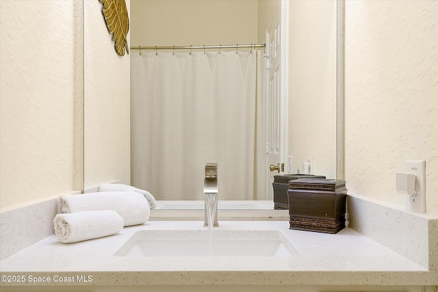 2648 Daulby St, Kissimmee, FL 34747 - full bath with a textured wall and vanity
