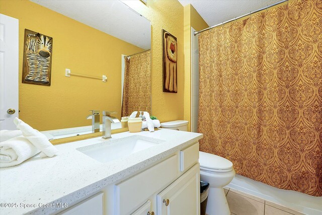 2648 Daulby St, Kissimmee, FL 34747 - full bath with toilet, tile patterned flooring, vanity, curtained shower, and a textured ceiling