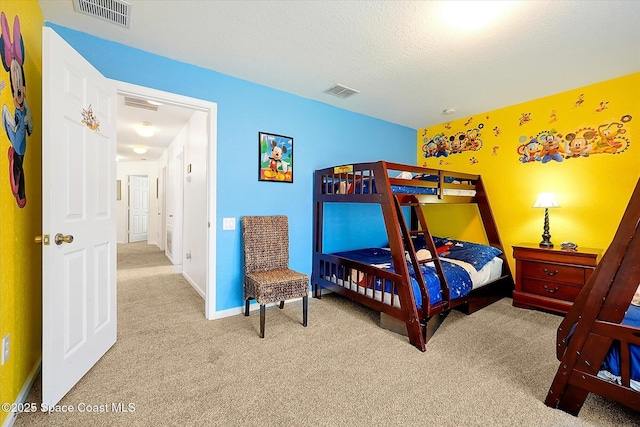 2648 Daulby St, Kissimmee, FL 34747 - carpeted bedroom with baseboards and a textured ceiling
