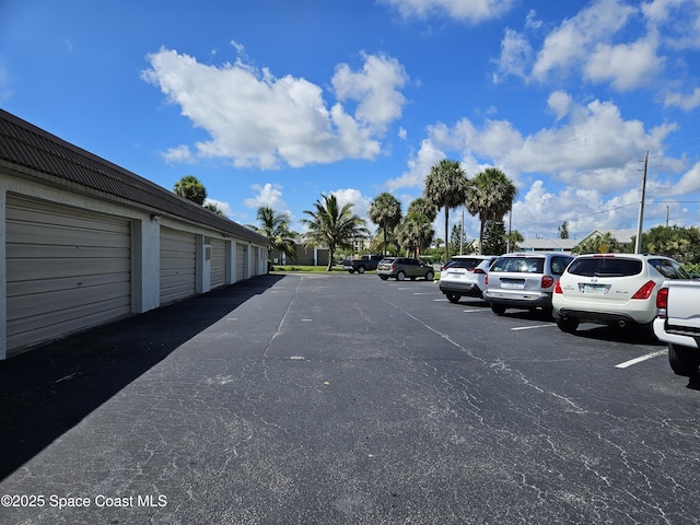 1700 S Atlantic Ave Unit 107, Cocoa Beach, FL 32931 - uncovered parking lot with community garages