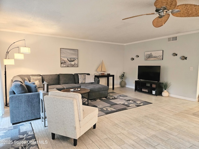 1700 S Atlantic Ave Unit 107, Cocoa Beach, FL 32931 - living area with a ceiling fan, crown molding, baseboards, and wood finished floors