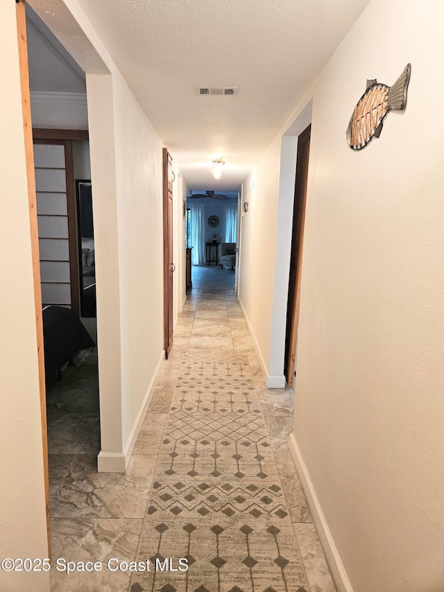1700 S Atlantic Ave Unit 107, Cocoa Beach, FL 32931 - corridor with baseboards