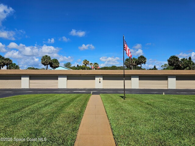 1700 S Atlantic Ave Unit 107, Cocoa Beach, FL 32931 - view of front of home featuring a front yard