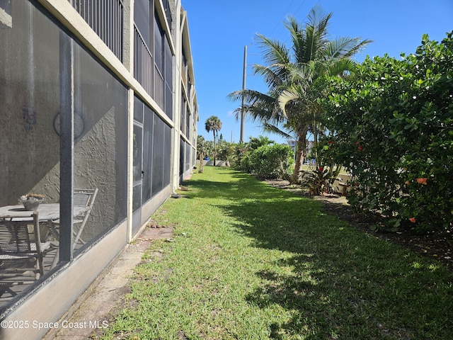 1700 S Atlantic Ave Unit 107, Cocoa Beach, FL 32931 - view of grassy yard
