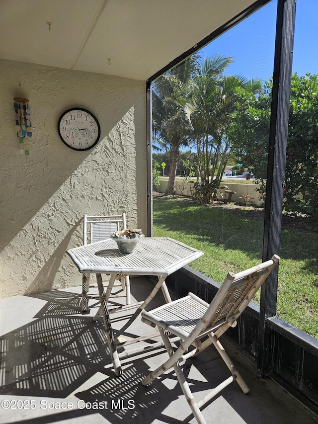 1700 S Atlantic Ave Unit 107, Cocoa Beach, FL 32931 - sunroom with plenty of natural light