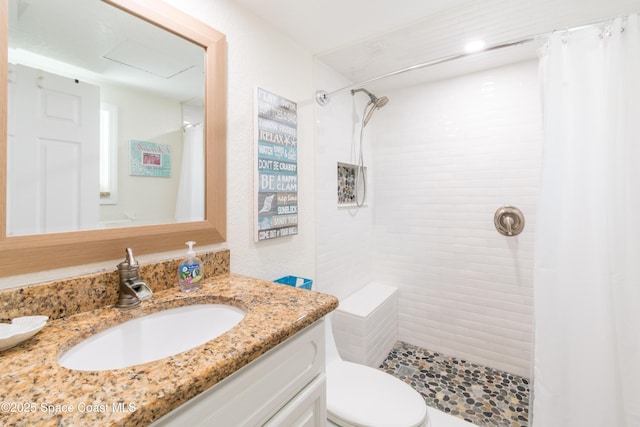 1145 S Atlantic Ave Unit B, Cocoa Beach, FL 32931 - full bath with a tile shower, vanity, and toilet