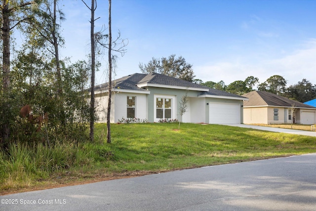 3258 Forghun Ave SE, Palm Bay, FL 32909 - view of front facade with a garage, concrete driveway, stucco siding, and a front yard