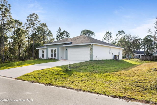 3258 Forghun Ave SE, Palm Bay, FL 32909 - view of front of property with stucco siding, a garage, a front yard, and concrete driveway