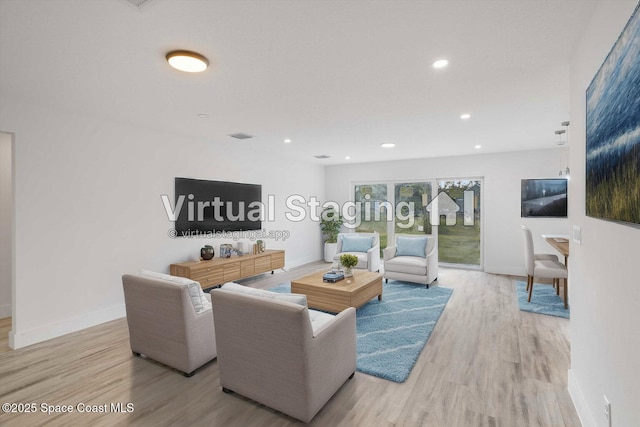 3258 Forghun Ave SE, Palm Bay, FL 32909 - living area with wood finished floors, baseboards, and recessed lighting