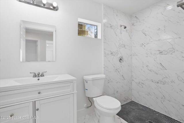 3258 Forghun Ave SE, Palm Bay, FL 32909 - full bathroom featuring vanity, a stall shower, toilet, and marble look tile flooring