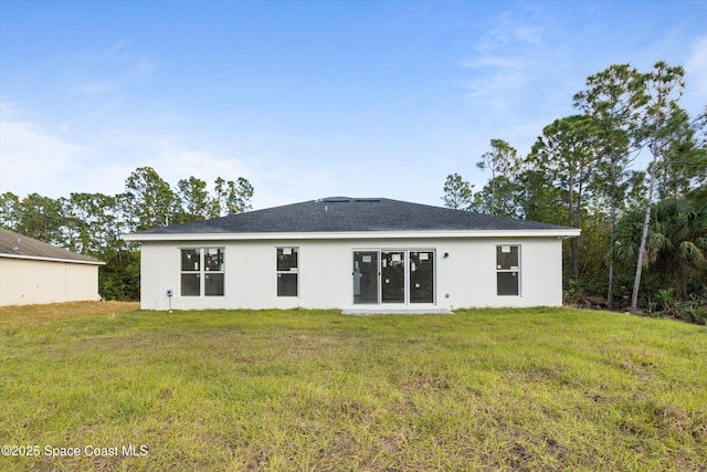 3258 Forghun Ave SE, Palm Bay, FL 32909 - rear view of property featuring stucco siding and a lawn