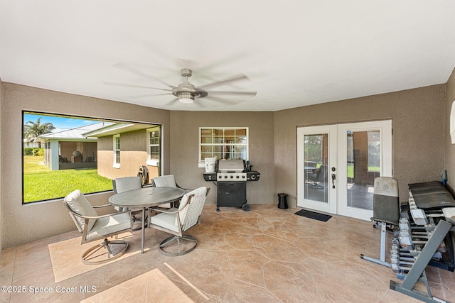 view of patio featuring french doors, a ceiling fan, and area for grilling