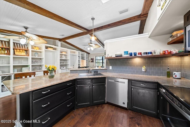 kitchen featuring dishwasher, ceiling fan, a sink, open shelves, and dark cabinets