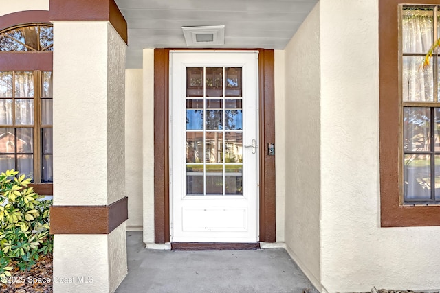 2805 Forest Run Dr, Melbourne, FL 32935 - doorway to property with stucco siding
