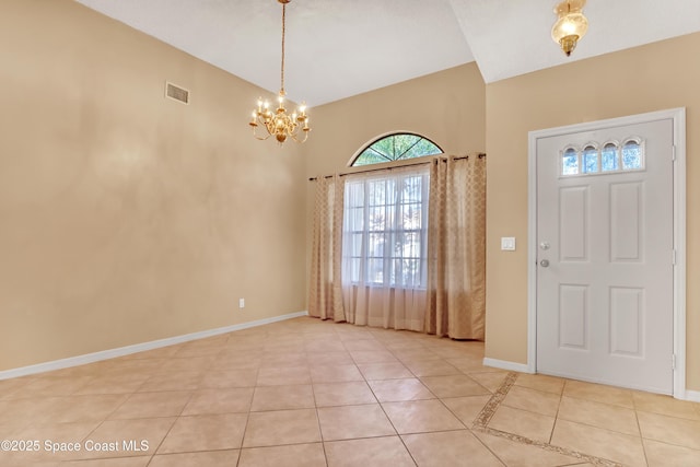 2805 Forest Run Dr, Melbourne, FL 32935 - foyer entrance featuring light tile patterned floors, a chandelier, and baseboards