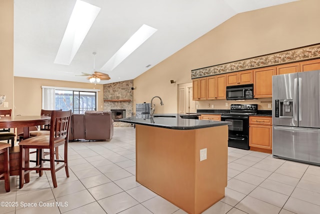 2805 Forest Run Dr, Melbourne, FL 32935 - kitchen featuring black appliances, high vaulted ceiling, a sink, dark countertops, and a skylight