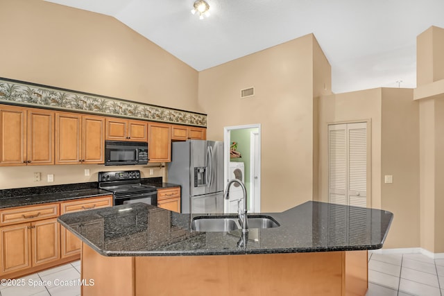 2805 Forest Run Dr, Melbourne, FL 32935 - kitchen featuring black appliances, high vaulted ceiling, a sink, light tile patterned floors, and a center island with sink