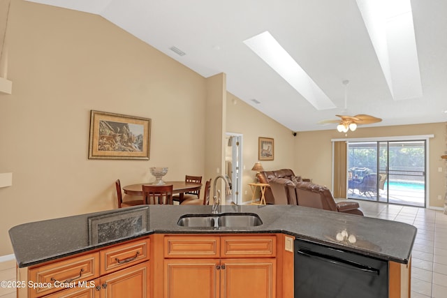 2805 Forest Run Dr, Melbourne, FL 32935 - kitchen featuring dishwasher, a sink, open floor plan, a skylight, and light tile patterned floors