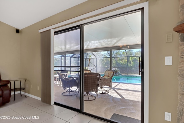 2805 Forest Run Dr, Melbourne, FL 32935 - entryway featuring a sunroom, tile patterned floors, and baseboards