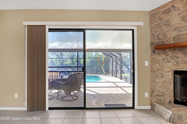 2805 Forest Run Dr, Melbourne, FL 32935 - doorway to outside featuring a sunroom, baseboards, and light tile patterned flooring