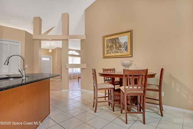2805 Forest Run Dr, Melbourne, FL 32935 - dining room with baseboards, light tile patterned flooring, and high vaulted ceiling